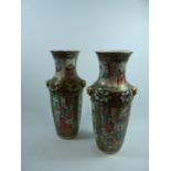 Pair of 19thC Cantonese figural decorated vases with Verde borders, 25cm in height. Condition - Some