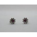 Pair of Ladies Diamond & Ruby Daisy design earrings, 1.2ct estimated Diamond weight and 0.30ct