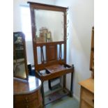 Edwardian Walnut Hall stand with mirror back over glove box and turned supports