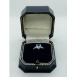 Good Quality Ladies 18ct White Gold Ring with Oval Claw set Blue Topaz 1.8ct flanked by Pear