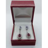 Pair of Bright 18ct White Gold Diamond and Ruby Cluster drop earrings under Diamond claw settings,