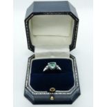 Ladies 18ct White Gold Ring with Trillion Claw set Emerald 1ct estimated flanked by Claw set