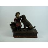 J & E Stevens Speaking Dog Cast Iron Money Bank with seated girl and dog figures on red base with