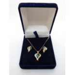 Ladies 9ct gold earring and Pendant suite set with Milligrain Diamonds and Synthetic Emeralds, 5.