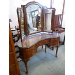 20thC Walnut fronted kidney shaped dressing table with triptych mirror, brass drop handles over long