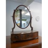 Georgian Mahogany oval framed table mirror with bow fronted base