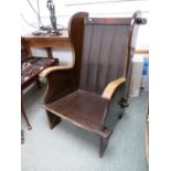 Interesting Oak Panel backed Elbow chair of peg construction