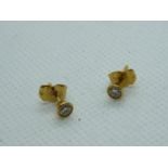 Pair of Ladies 9ct Yellow gold Diamond Rub-over Studs 0.30ct total weight