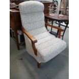 Arts & Crafts Oak framed rocking chair with ribbed upholstery
