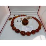 Rumanian Amber graduated Bead necklace, Oval Yellow metal set Amber Pendant on 9ct Gold Chain and