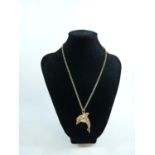 Interesting Ladies 9ct Gold Necklace with a Diamond, Emerald and Ruby set 9ct Gold Dolphin