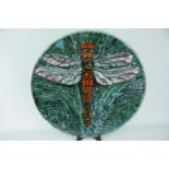A Poole Pottery Studio charger by Tony Morris depicting a single Dragonfly with outstretched wings