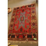 Good Quality Persian Rug of Geometric design red Ground. 194 x 134cm