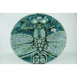 A Poole Pottery Studio charger by Tony Morris depicting a single Dragonfly with outstretched wings