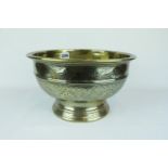 A Finely Decorated Islamic Persian Brass Bowl with crosshatch decoration over stepped base, 27cm