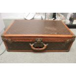 VINTAGE LOUIS VUITTON SUITCASE an early 20thc monogrammed suitcase with leather trim, brass studs