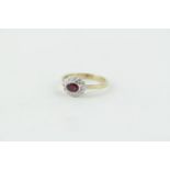 Lovely 9ct Gold Oval Ruby and Diamond cluster ring, 3g total weight. Size Q