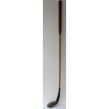 A fine Army & Navy CSL long nose putter made c1880. Stained beach wood shaft with makers stamp