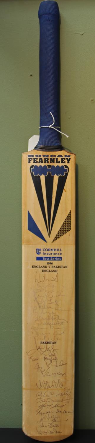 A full size Duncan Fearnley bat hand signed by the England & Pakistan teams at the 1996 Test Series.