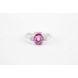 Ladies 18ct White Gold Oval Pink Sapphire 2.08ct Claw set ring flanked by 2 Round Brilliant Cut