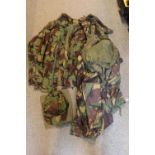 Travelling case of assorted Camo clothing and Textiles