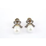 Pair of Edwardian Style Ribbon design Diamond set earrings terminating on Pear shaped Cultured