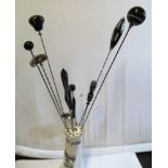 Twelve Victorian agate and other black stone hat pins in crested china hat pin holder