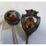 A Scottish white metal stick pin set hardstones (i.c.) and another shield shaped Scottish stick