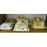 Five Carlton ware butter dishes.