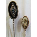 A 19th Century stick pin painted scene of lady with scales and a Victorian onyx stick pin set seed