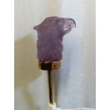 A Victorian stick pin carved amethyst eagle head