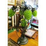 A modern metal large table lamp of grape and vine leaf design.