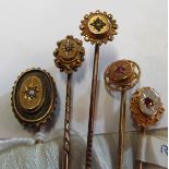 Five various Victorian yellow metal stick pins set various stones