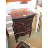 A pair of mahogany four drawer bedside chests