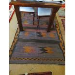 A brown and black ground Kelim runner 9'x4'.