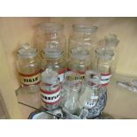 Ten glass storage jars some with lids