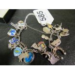 A silver charm bracelet hung and charms