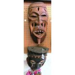 Two African tribal masks.