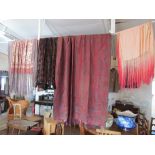 Four vintage shawls including; large paisley design, embroidered with tassels, pink silk with