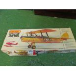 A Matchbox Tiger Moth kit, Airfix kit Lifeboat and Sea King Helicopter and a Monogram B29 plane