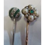 A Victorian seed pearl and emerald stick pin and an emerald and diamond ball stick pin