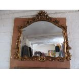 A gilt shaped mirror