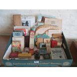 A collection of items from an old Post Office including; books, crib boards, cards, money box,