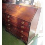 An early 19th Century mahogany bureau fitted interior over four long graduated drawers.