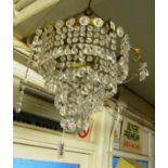 A four tier drop lustre chandelier with blue flower