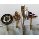 A stick pin with enamel coat of arms terminal, a 9ct gold stick pin with enamel flag terminal,