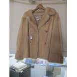 A champagne coloured mink jacket by Dudkin Brighton.