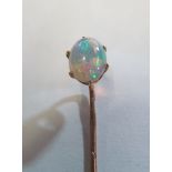 A 9ct gold stick pin set opal (i.c.)