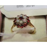 A 9ct gold ring garnet and opal cluster ring