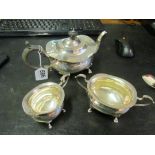 A silver three piece tea set 20.5ozs.